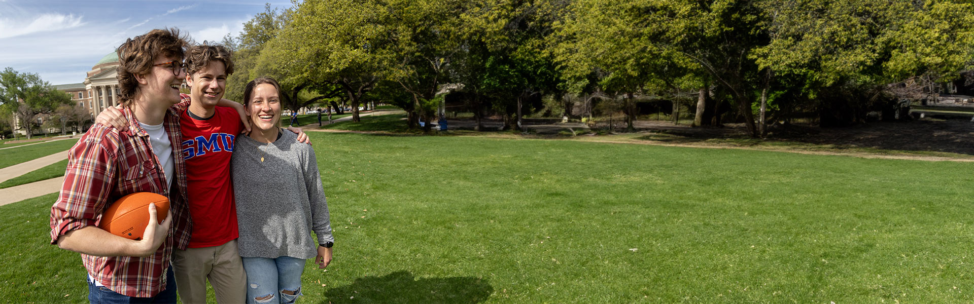 SMU students playing on the lawn