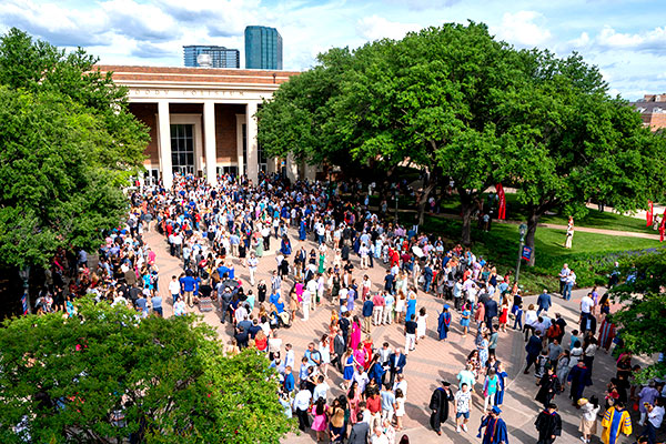 Guests mingling in front of  Moody Coliseum