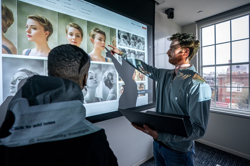 SMU researchers review image files on a projection screen