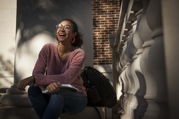 student sitting on steps